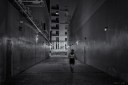 Man running in an alley at night
