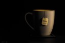 Mug of Earl Grey tea in shadow