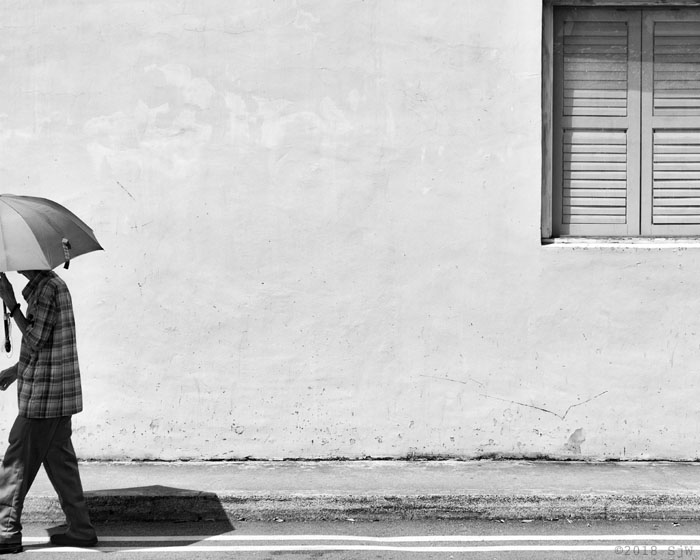 Man walking with an umbrella